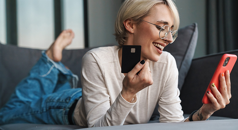 Woman using her crediyt card to order THC delivery in Delta BC. Buy weed online from The Purple Butler online dispensary. Budget bud and value buds. cheap canna dispensary.